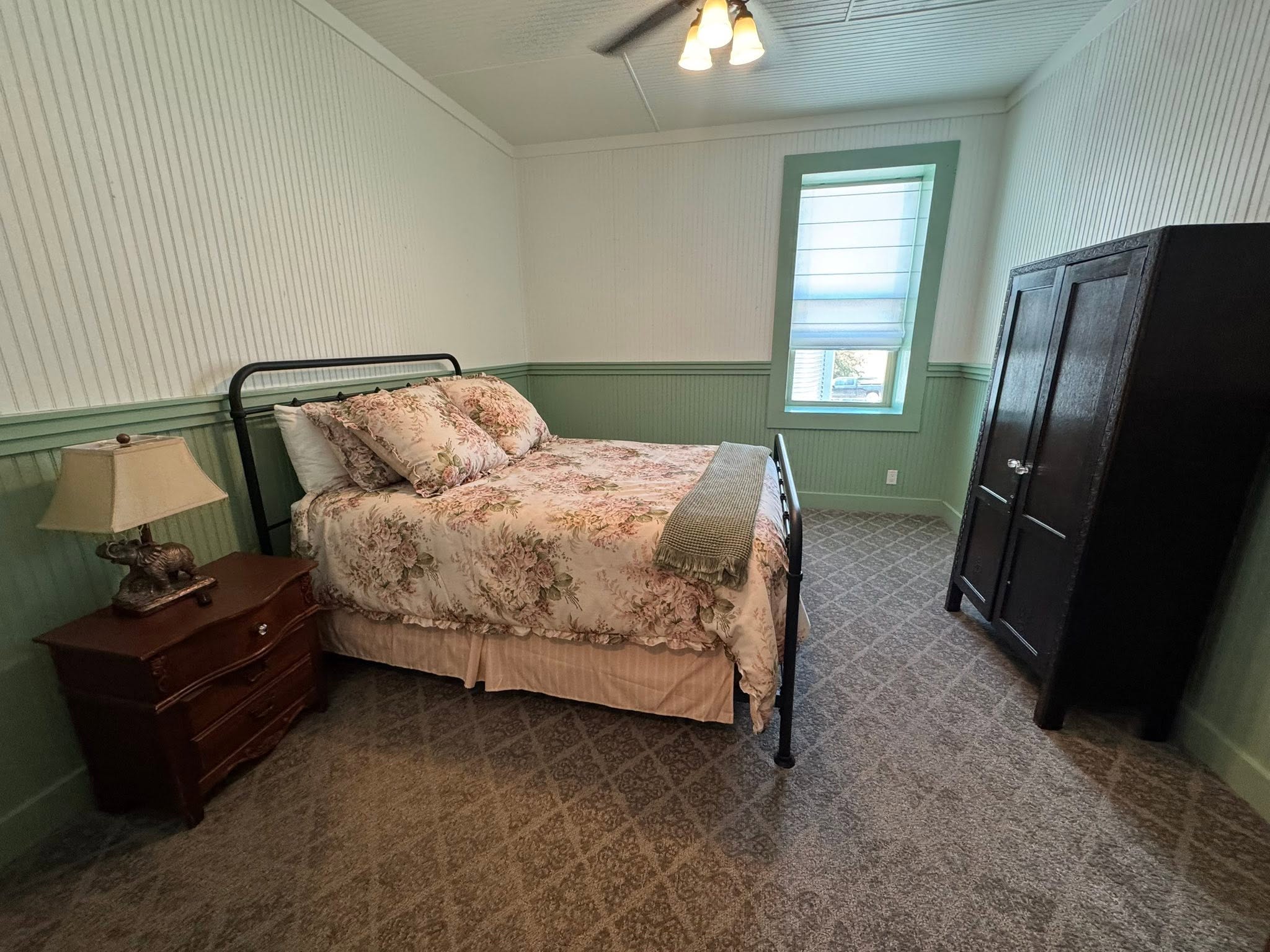 Warmly finished bedroom within the atmospheric GMTV Garage property