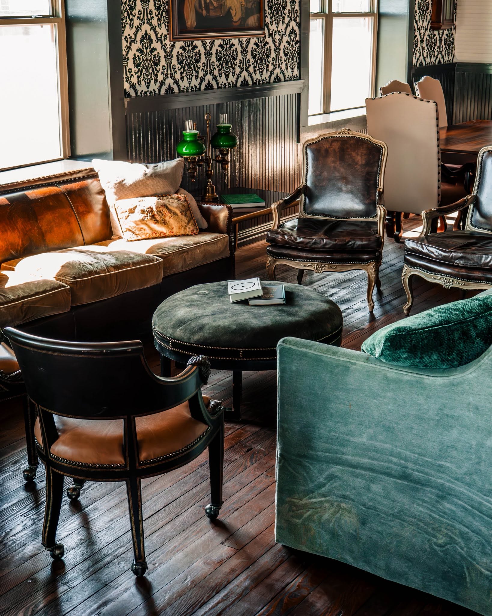 Leather chairs and vintage furnishings in a GMTV Garage lounge