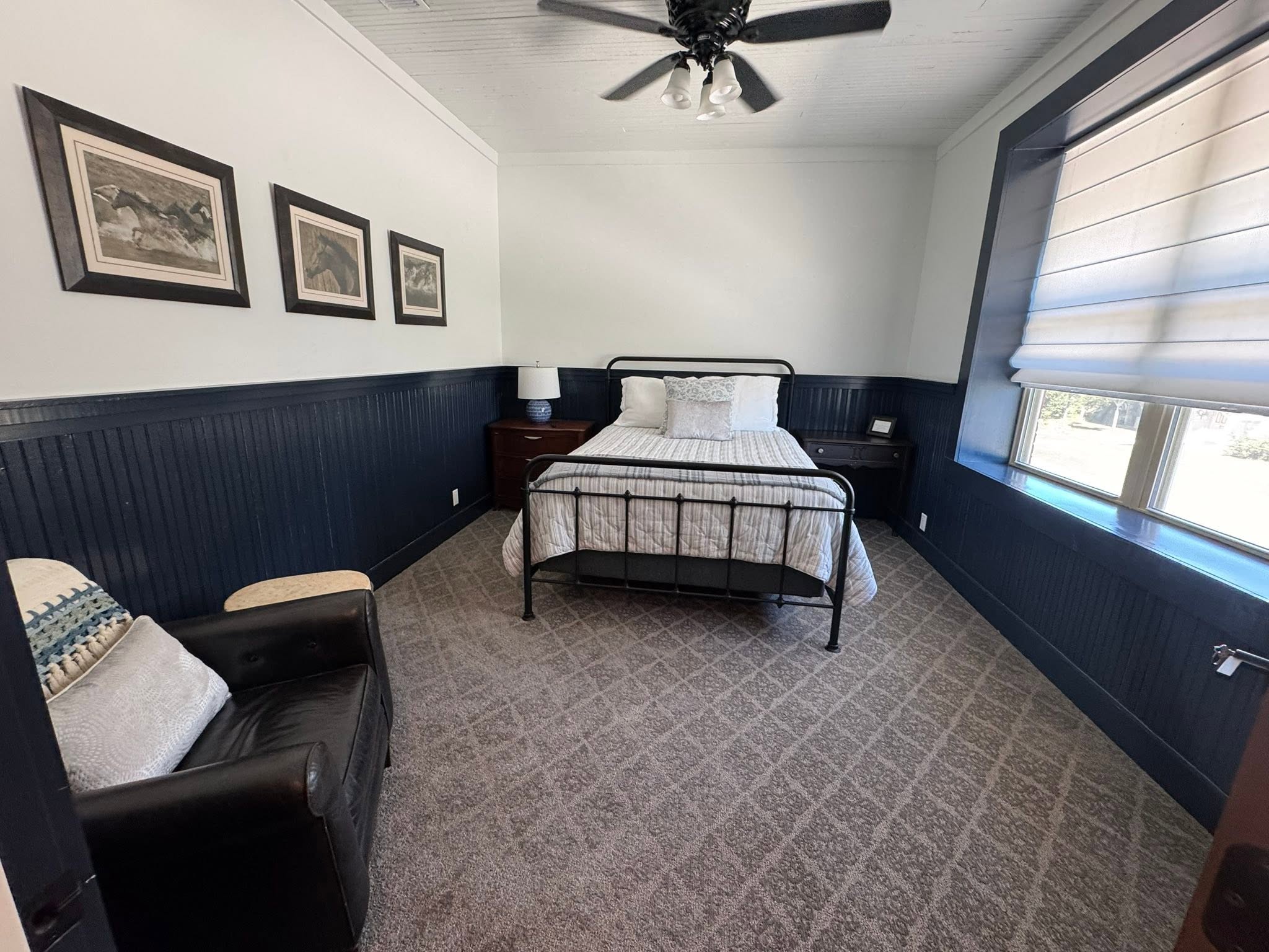 Black and cream guest room inside the GMTV Garage property