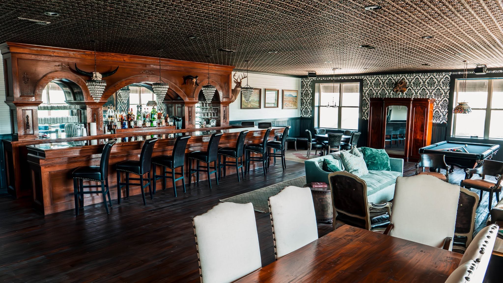 Wide view of the carved saloon bar and dining space at GMTV Garage