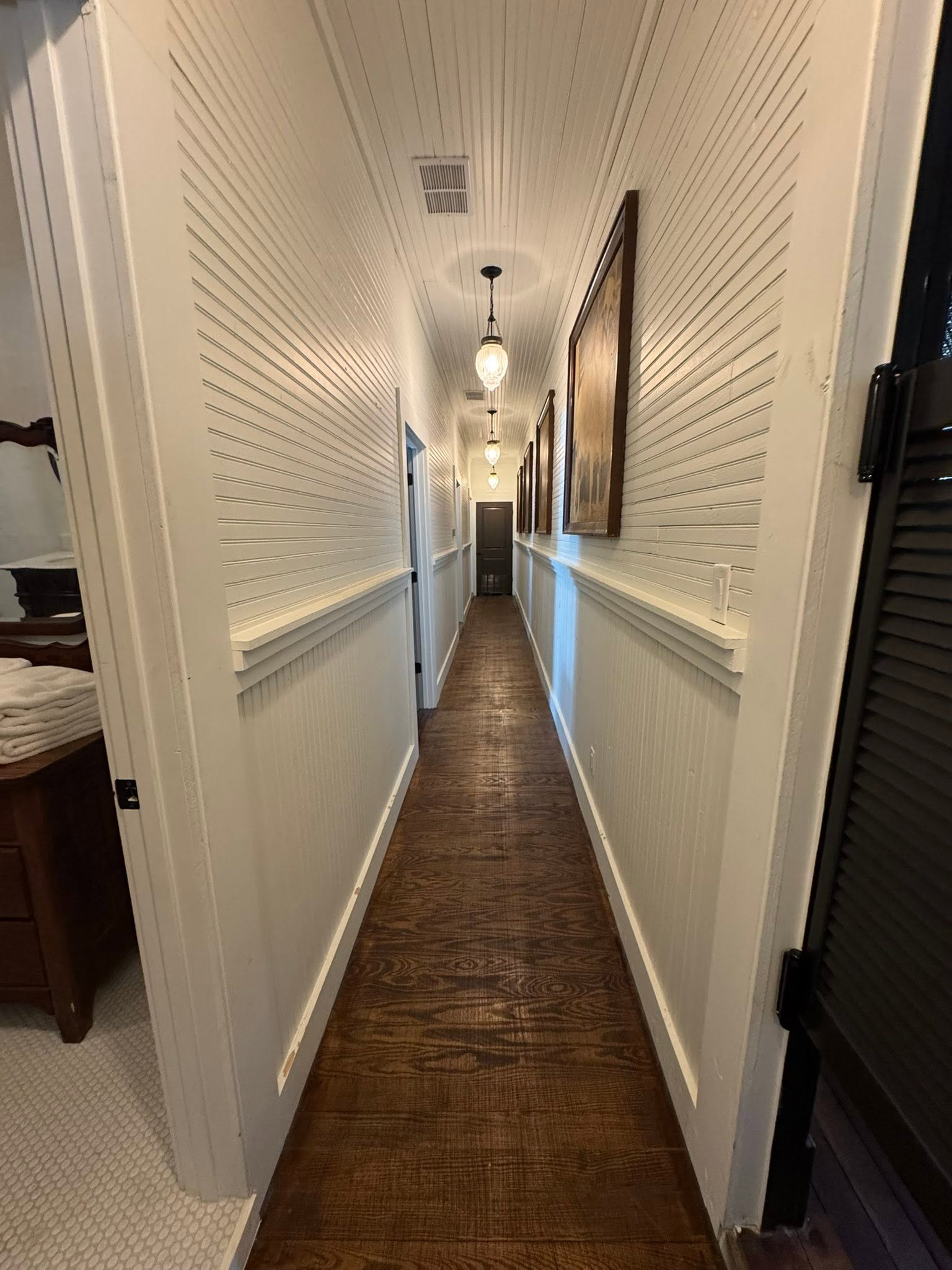 Long wood-floored hallway inside the historic GMTV Garage property