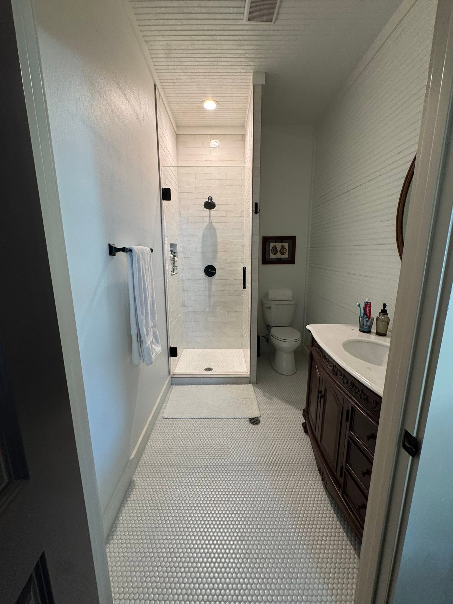 Marble vanity and bright shower inside the GMTV Garage property